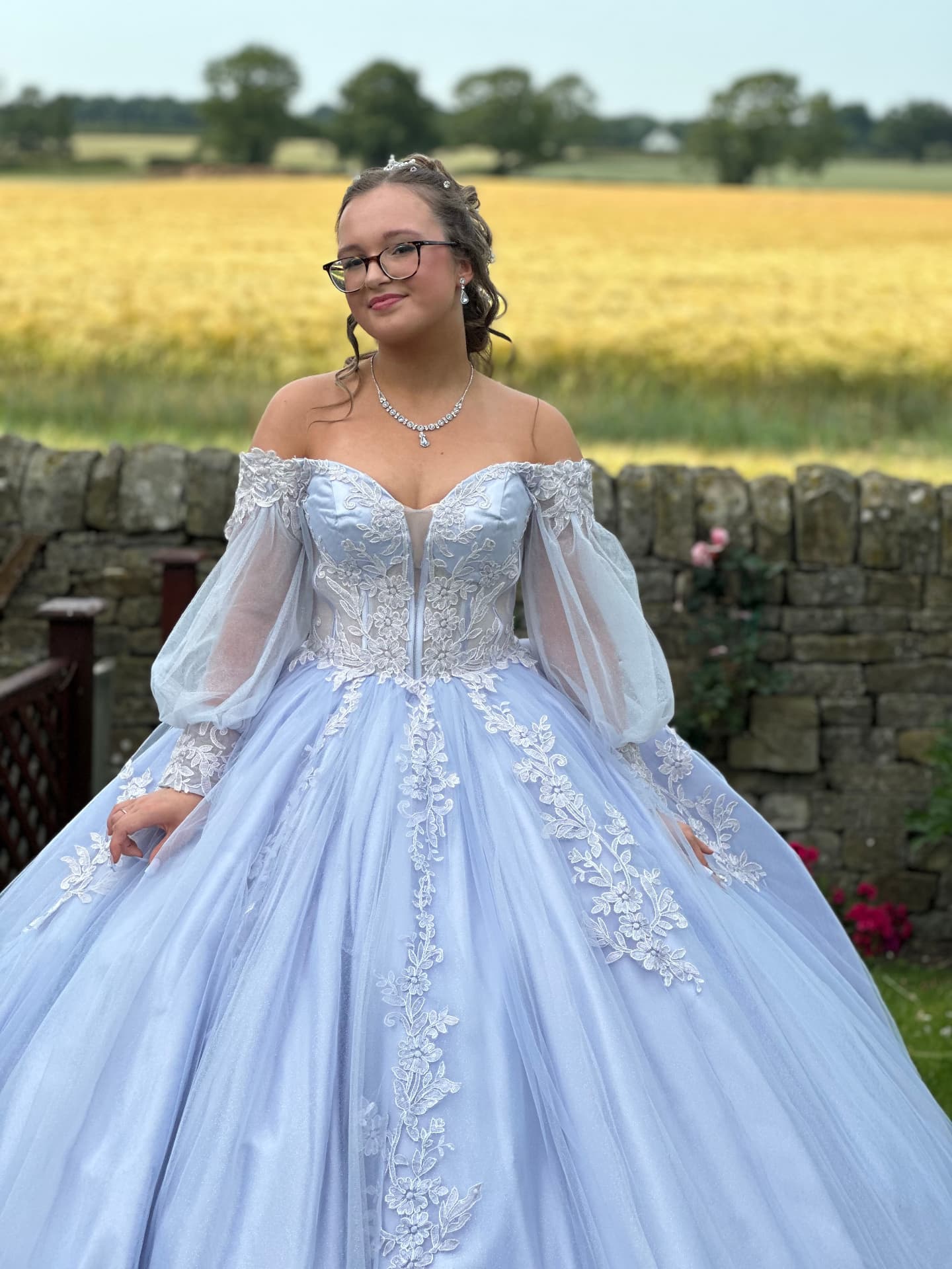Full length prom portrait in a pale blue ballgown